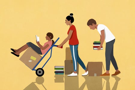 3 people reading, packing and moving boxes of books with hand truck