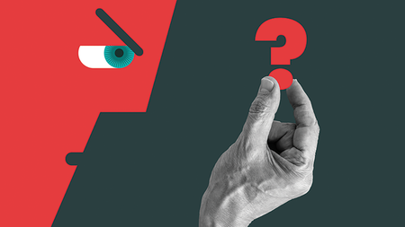 Man frowning while holding a question mark symbol.